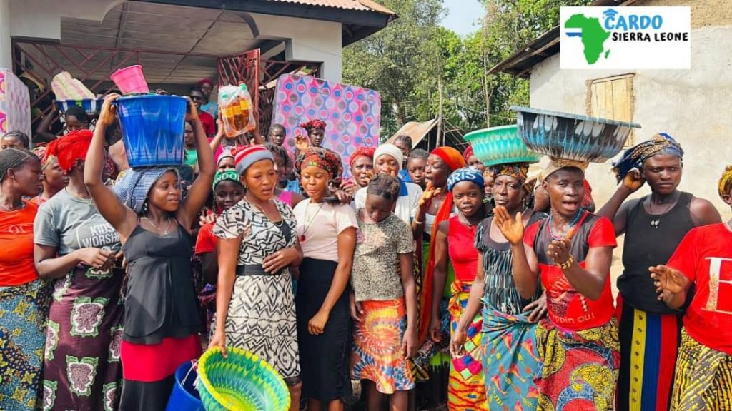 Women of the community gathered with baskets and basins