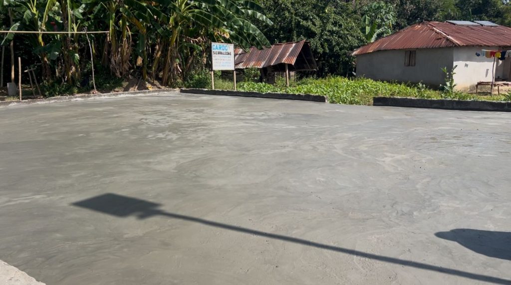 Newly finished concrete drying floor in Kasimberia village