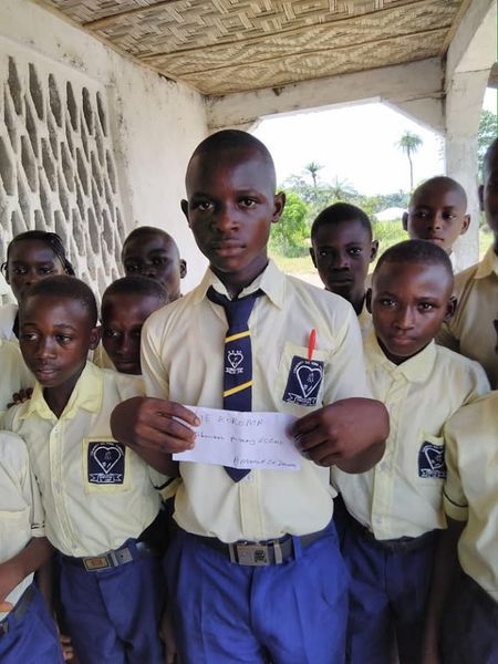 Boys in school uniform at a CARDO education programme