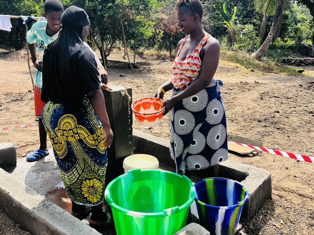 Women collecting water at a standpipe